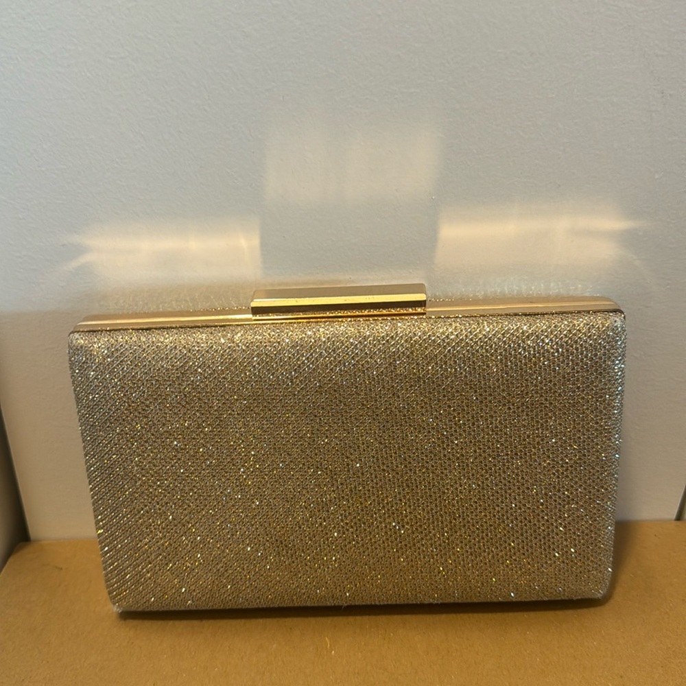 Sondra Robert’s Shimmery gold structured clutch bag